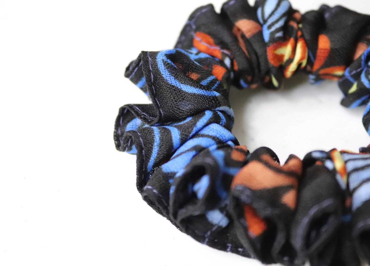 handmade hair scrunchie, floral scrunchie, black and blue, close up