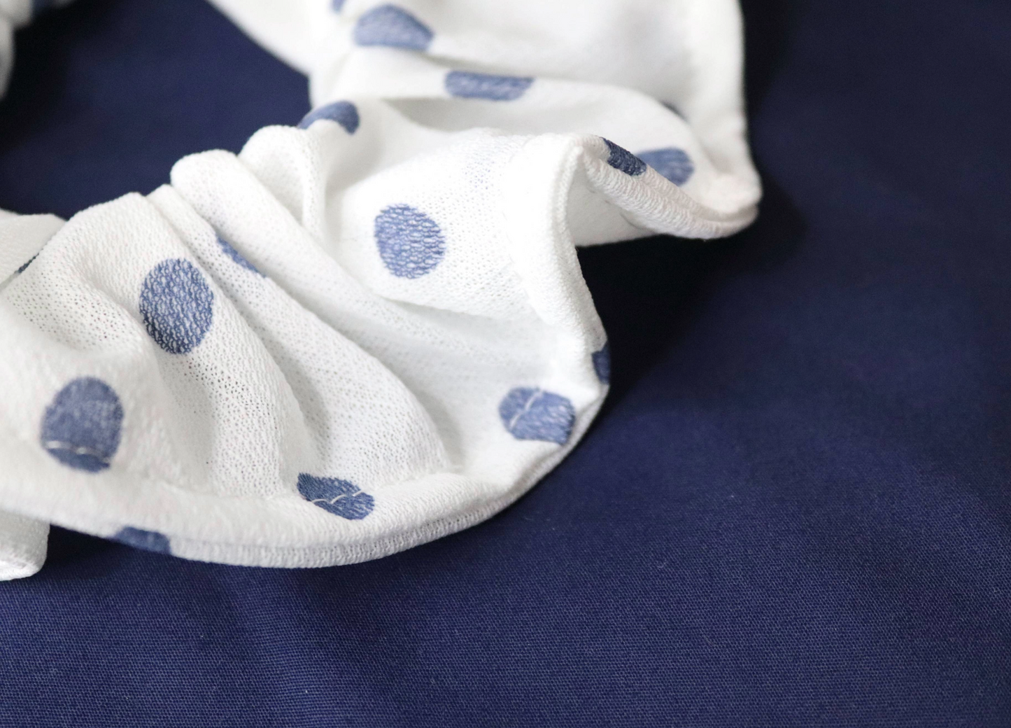 lightweight white polka dot oversized scrunchie close up